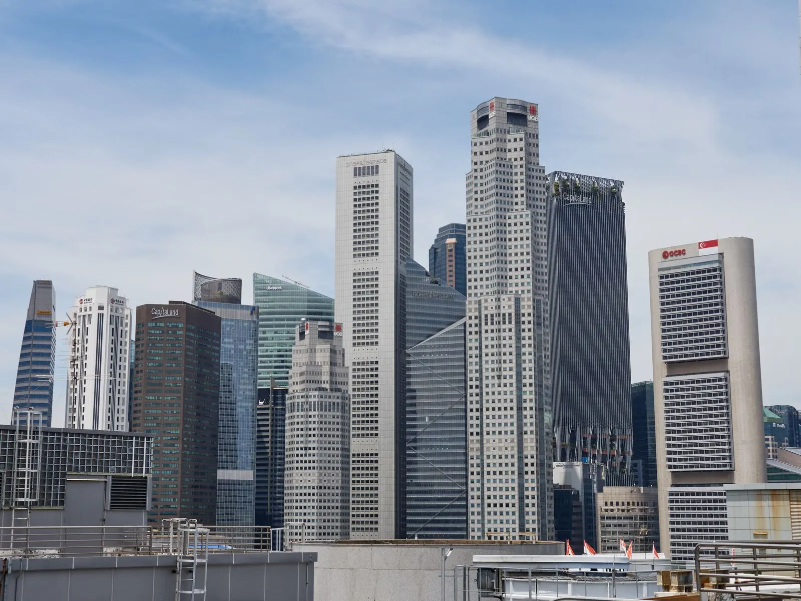Singapore CBD financial district skyline with high-rise office towers under a clear daytime sky